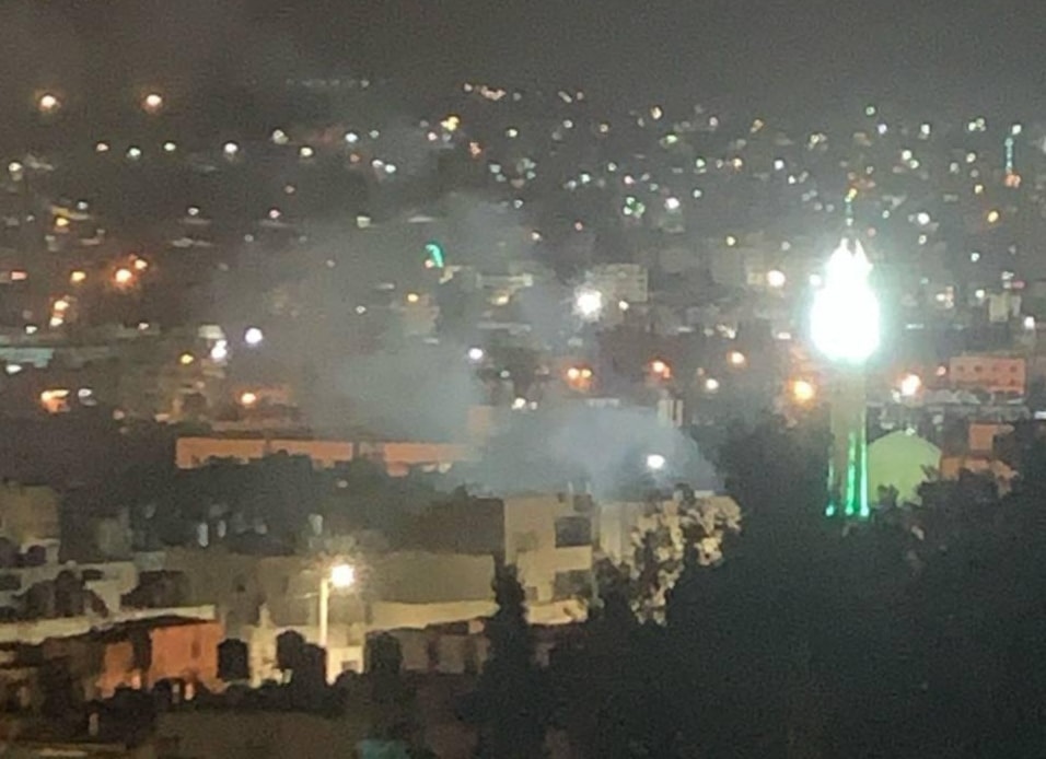 Smoke rises as the Palestinian Resistance targets invading IOF with an explosive device amid confrontations in the Old Askar camp in Nablus, occupied West Bank, on September 30, 2024. (Social media)