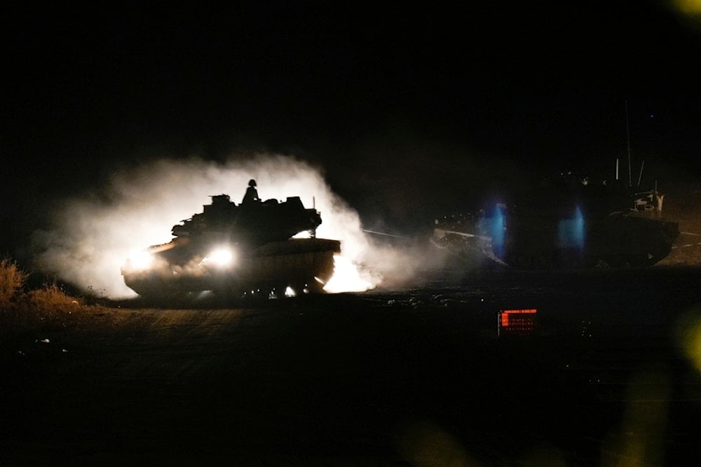 An Israeli tank maneuvers in northern occupied Palestine near the Lebanese-Palestinian border area, Monday, September 30, 2024 (AP)