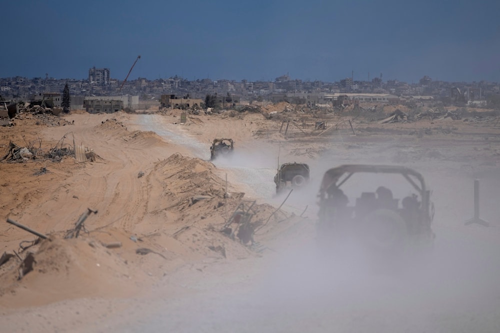 Israeli occupation forces vehicles transport a group of Israeli occupation soldiers and journalists inside the southern Gaza Strip, Palestine, July 3, 2024. (AP)