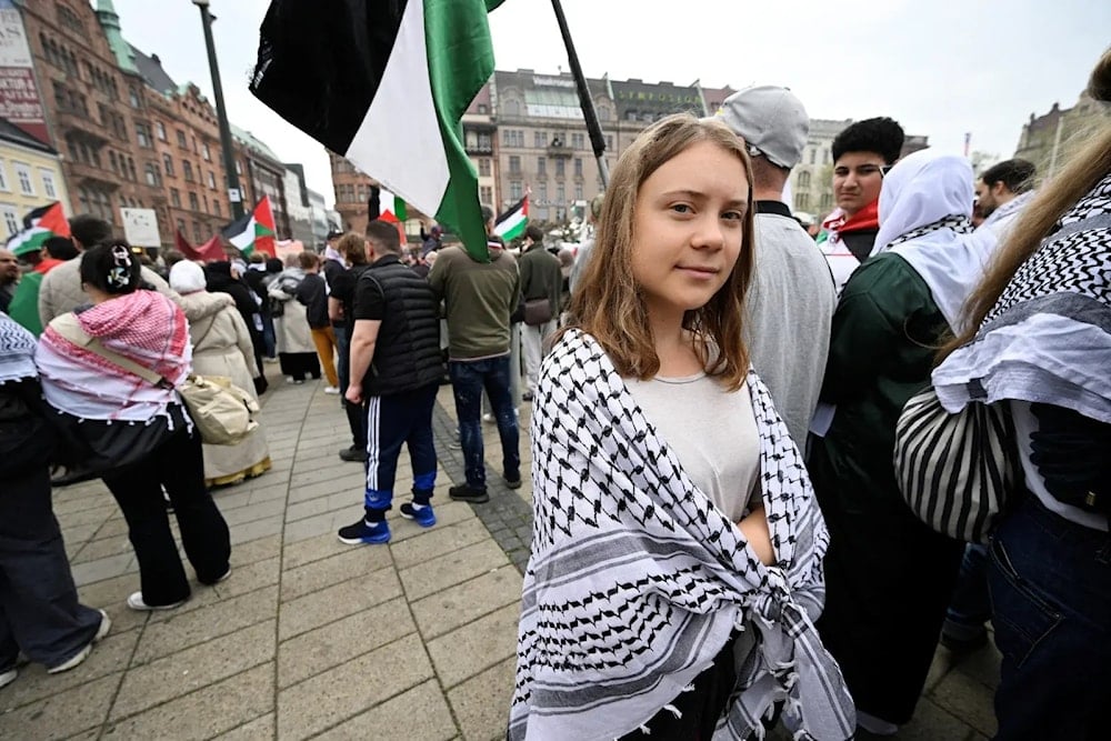 Climate activist Greta Thunberg takes part in a Stop Israel demonstration, between Stortorget and Mölleplatsen in Malmo, Sweden. (AFP)