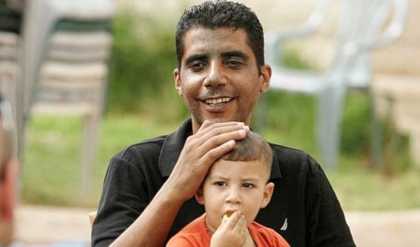 An old image uniting Resistance leader Zakaria Zubeidi with his now martyred son Mohammad Zubeidi when he was still a child. 