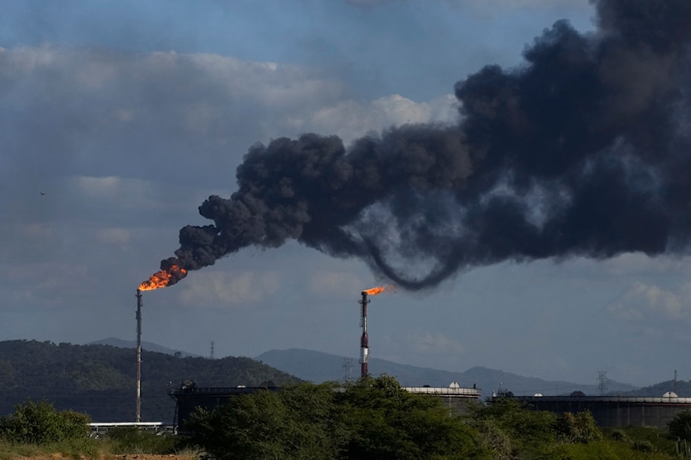 Gas is flared at the Jose Antonio Anzoategui oil complex in Barcelona, Anzoategui state, Venezuela, January 9, 2024 (AP)