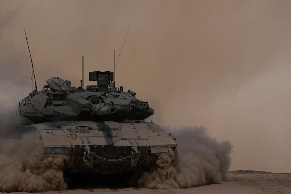 An Israeli tank manoeuvres near the Gaza border, southern occupied Palestine, Thursday, Aug. 29, 2024. (AP)