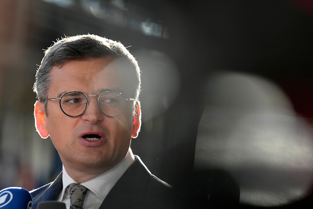 Ukraine's Foreign Minister Dmytro Kuleba speaks with the media as he arrives for a meeting of EU foreign ministers at the European Council building in Brussels, Thursday, Aug. 29, 2024.