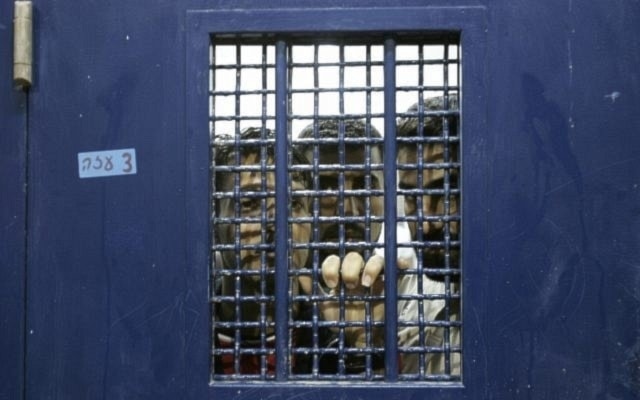 Palestinian detainees stand in a cell, pending their release from Ketziot prison in “Israel”, on October 1, 2007 (AP)