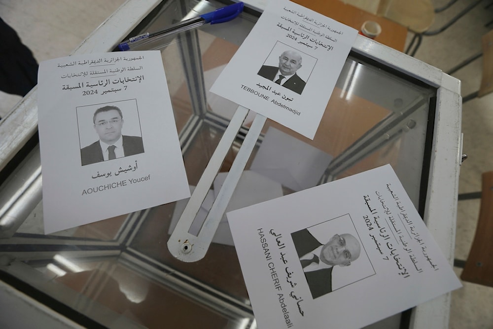 Ballots showing the three presidential candidates are placed on a table inside a polling station during the presidential election, September 7, 2024, in Algiers, Algeria (AP)