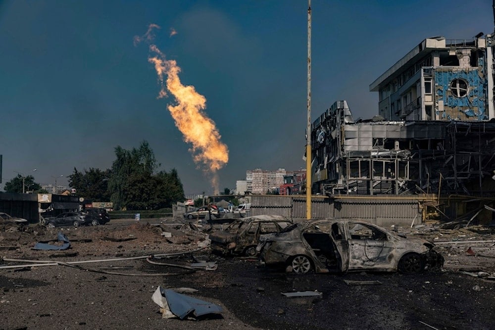 Gas burns in front of a business center damaged by a Russian attack in Kharkiv, Ukraine, Sunday, Sept. 1 2024. (AP Photo/Yevhen Titov)