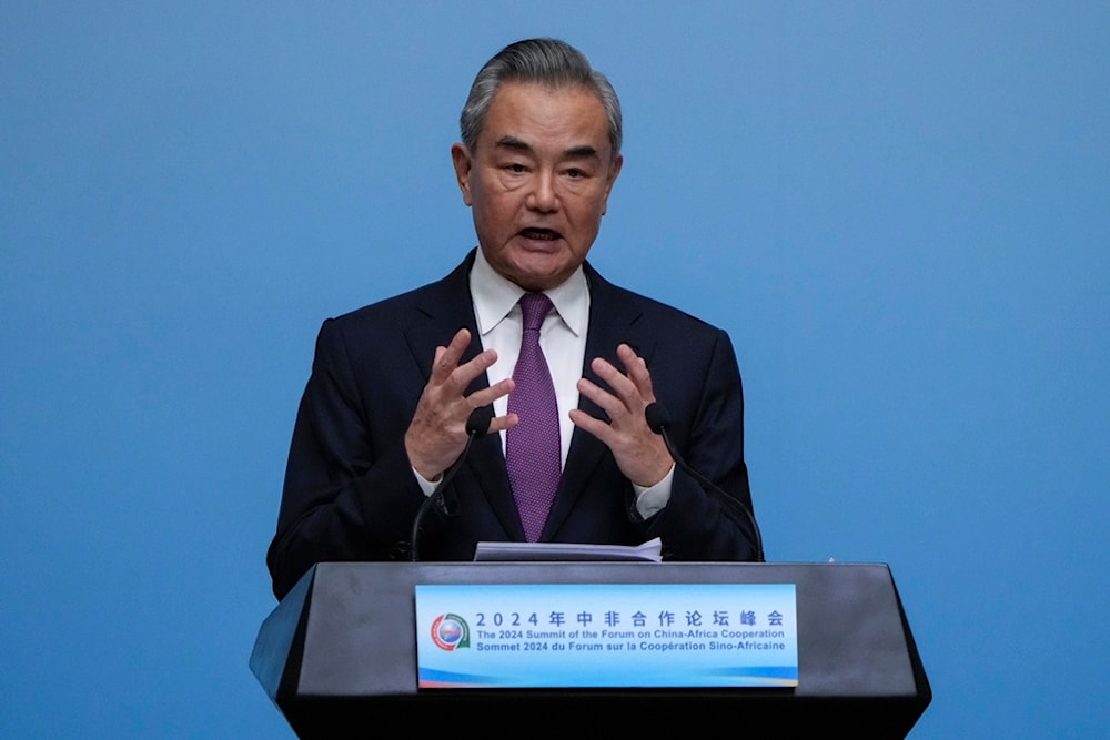 China's foreign minister Wang Yi speaks during a joint press conference with his counterparts from Senegal and Congo at the China Africa Forum in Beijing, Thursday, Sept. 5, 2024. (AP)