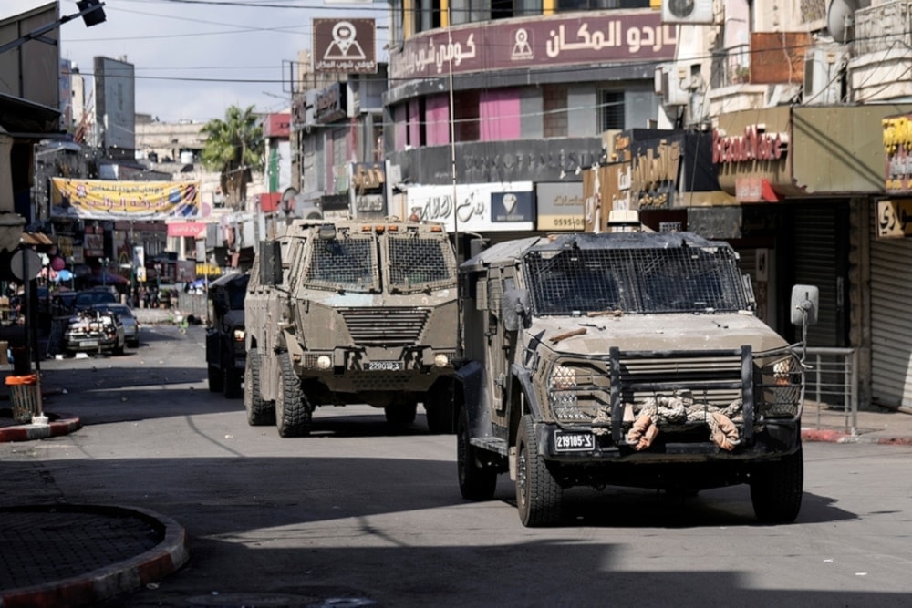 Israeli occupation forces move into the West Bank city of Nablus during a raid, Palestine, September 22, 2024. (AP)