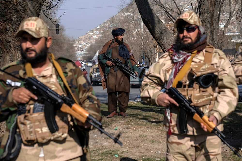 FILE - Taliban fighters stand guard in Kabul, Afghanistan, on Dec. 26, 2022. (AP Photo/Ebrahim Noroozi, File)