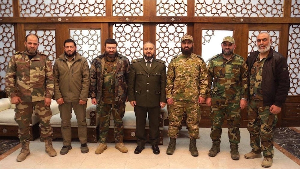 Members of Syria's Ministry of Defense pose for a picture with faction leaders. (@sayed_ridha)