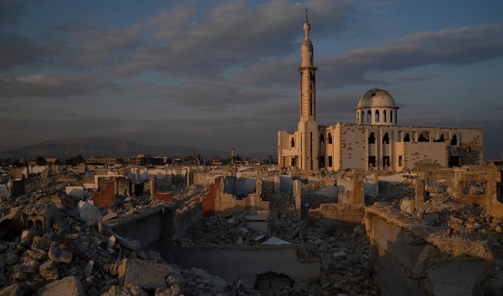 A heavily damaged mosque is seen surrounded by buildings that were completely destroyed during the civil war at the Al-Asali neighborhood in Damascus, Syria, Monday, Jan. 6, 2025. (AP)