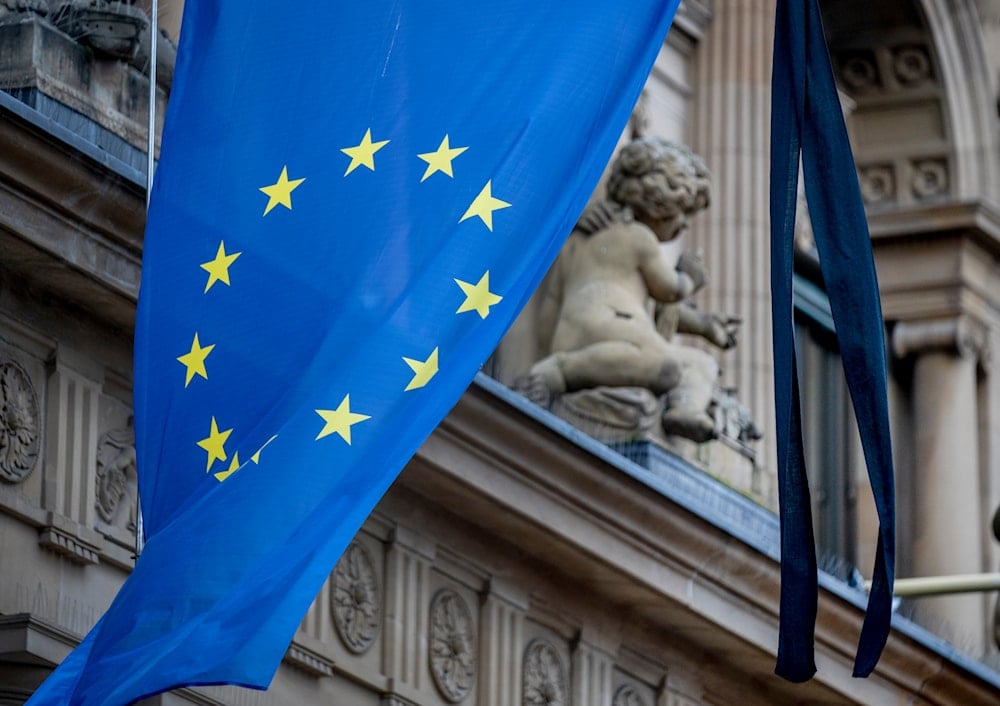 Black ribbons are fixed to the European flag at the stock market in Frankfurt, Germany, on February 24, 2022. (AP)