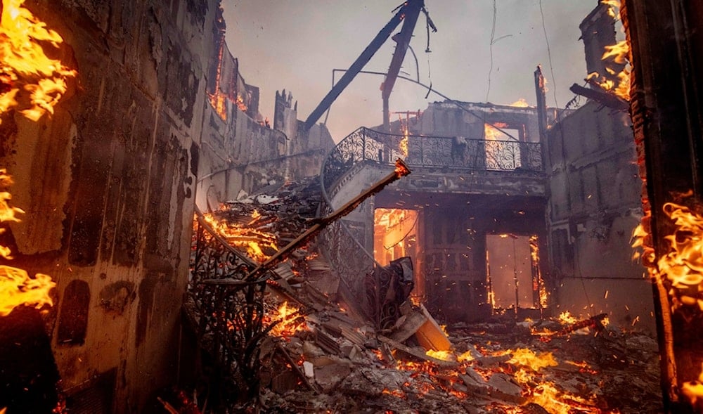 The Palisades Fire burns a residence in the Pacific Palisades neighborhood of Los Angeles, Tuesday, Jan. 7, 2025. (AP)