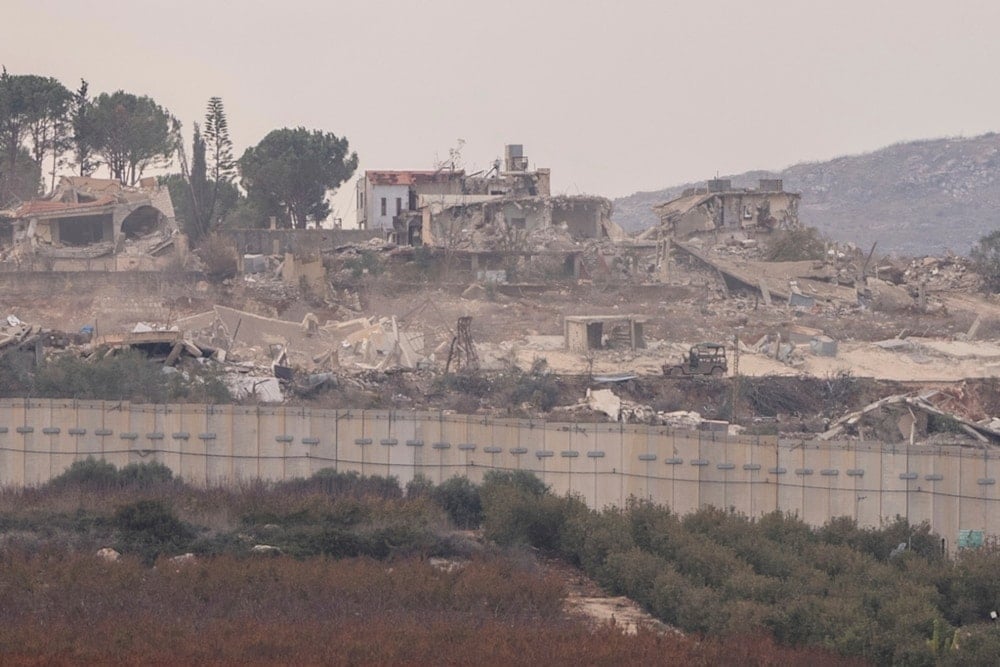 An Israeli military vehicle moves through the southern Lebanese town of Kfar Kila from the settlement of Metula, on Wednesday, December 4, 2024. (AP)