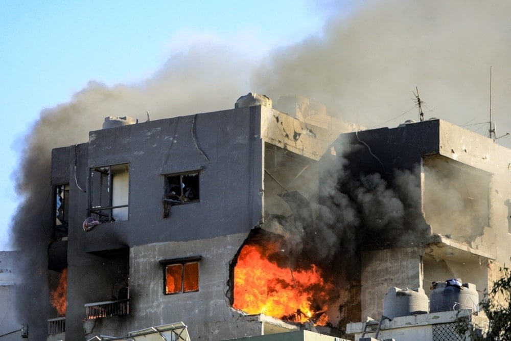 A fire burns in building targeted by an Israeli air strike in Beirut’s southern Suburb of Chiah, on October 22, 2024. (AFP)