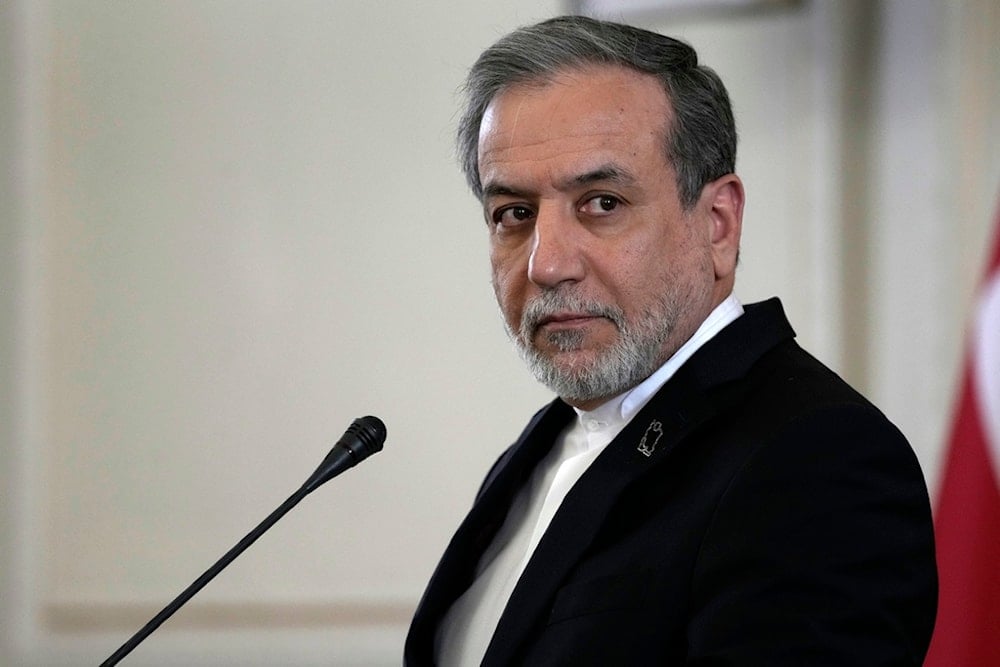 Iranian Foreign Minister Abbas Araghchi listens to a question in a joint press briefing with his Omani counterpart Sayyid Badr Albusaidi after their meeting in Tehran, Iran, Monday, Dec. 30, 2024 (AP)