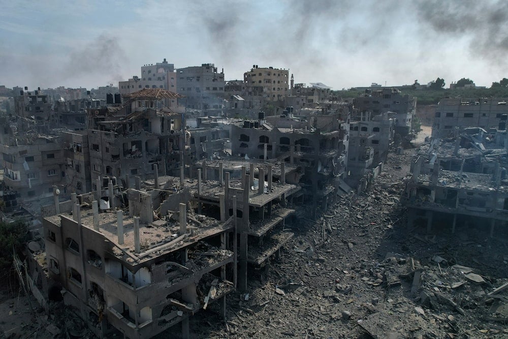 A view of the rubble of buildings hit by an Israeli airstrike, in Jabalia, Gaza strip, on October 11, 2023. (AP)