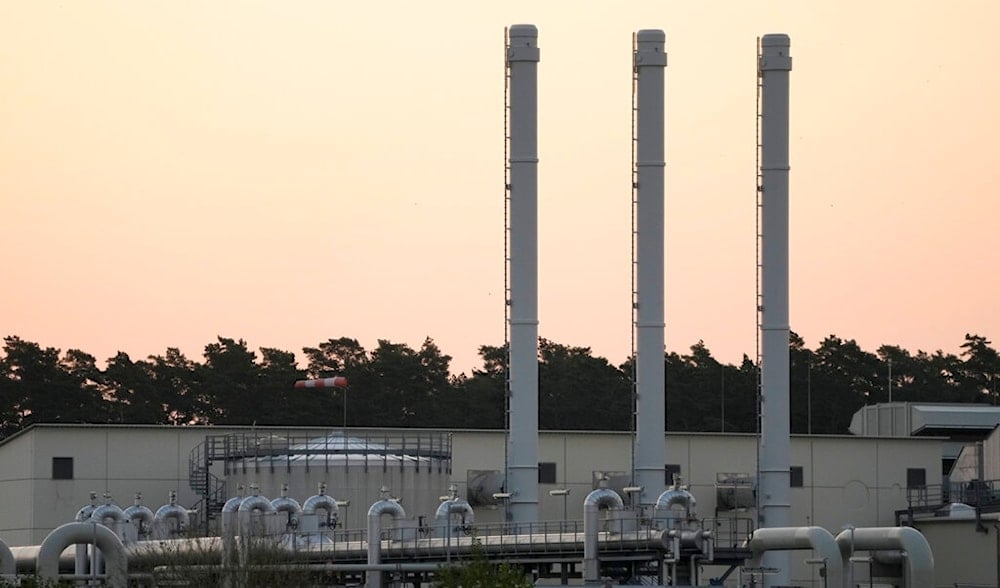 The sun rises behind the landfall facility of the Nord Stream 1 Baltic Sea pipeline and the transfer station of the OPAL gas pipeline, the Baltic Sea Pipeline Link, in Lubmin, Germany, July 21, 2022. (AP)