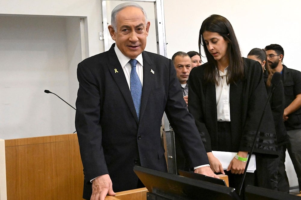 Israeli Prime Minister Benjamin Netanyahu attends the fifth day of testimony in his trial on corruption charges at the district court in Tel Aviv, occupied Palestine, on December 23, 2024. (Debbie Hill/Pool Photo via AP)