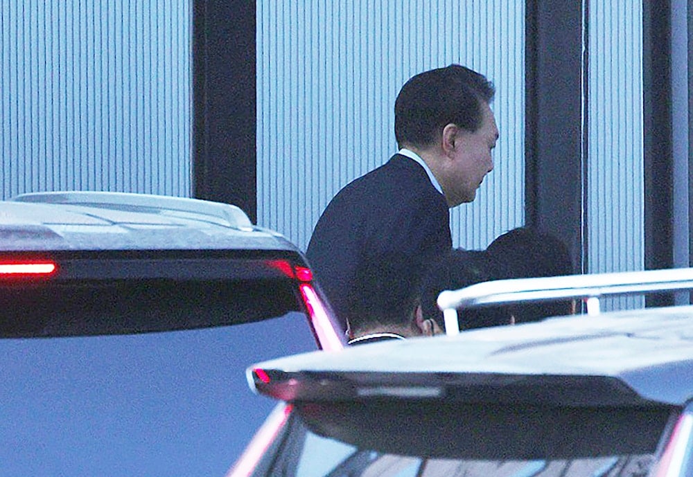 mpeached South Korean President Yoon Suk Yeol arrives at the Corruption Investigation Office for High-ranking Officials in Gwacheon, South Korea, on January 15, 2025. (Korea Pool via AP)