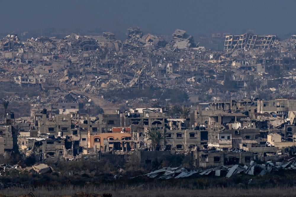 Destroyed buildings by Israeli bombardments as seen inside the Gaza Strip from the occupied territories, Thursday, Jan. 16, 2025. (AP Photo/Ariel Schalit)