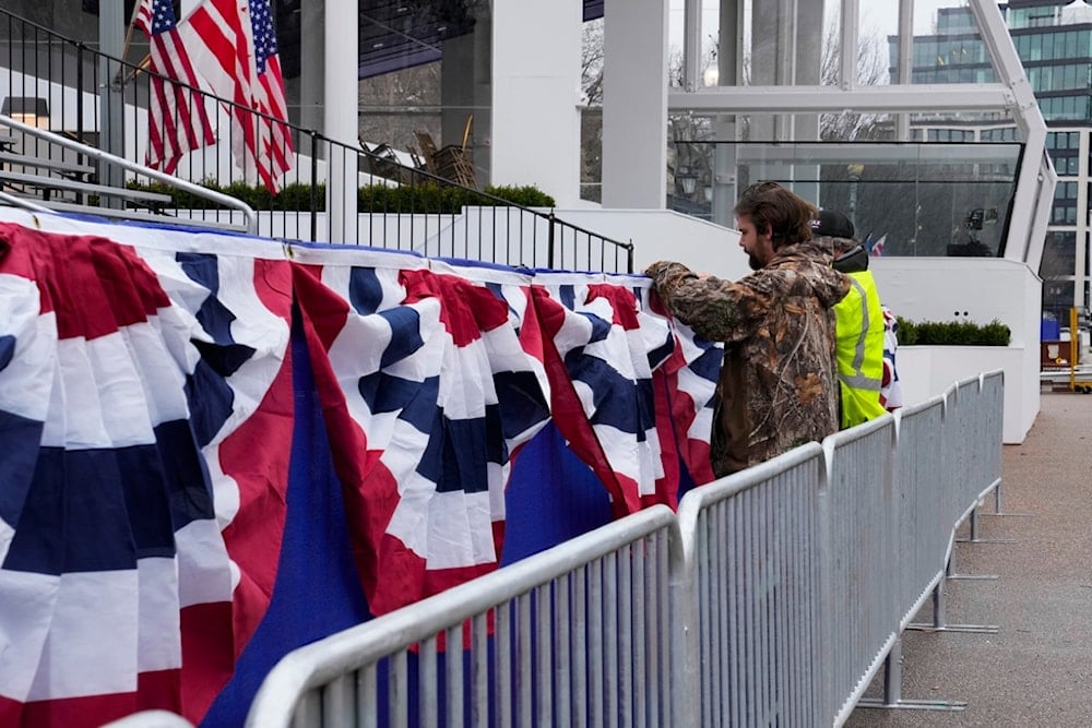 Work continues near the presidential reviewing stand on Pennsylvania Avenue outside the White House, Friday, Jan. 17, 2025, in Washington, ahead of President-elect Donald Trump's inauguration (AP)