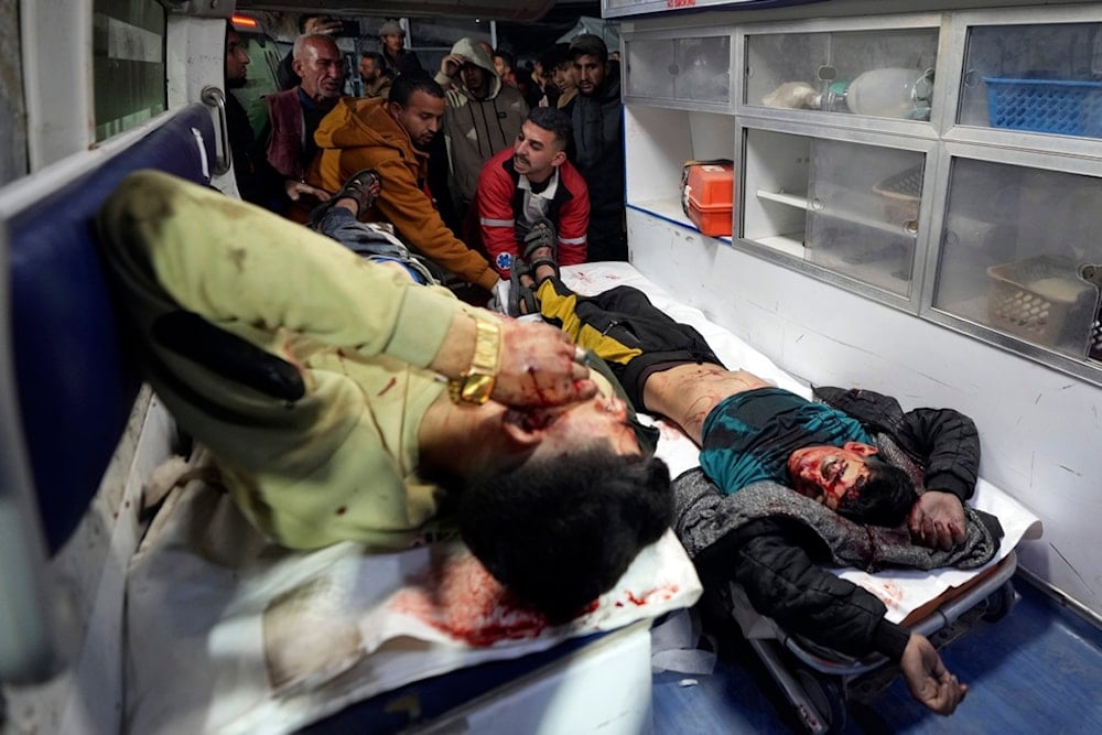 The body of a boy and a wounded man are brought to al-Aqsa Martyrs Hospital following Israeli occupation forces airstrikes, in Deir al-Balah, central Gaza Strip, Saturday, Jan. 4, 2025 (AP)