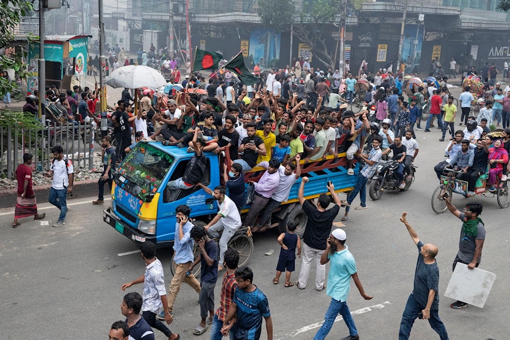 Protesters celebrate after news of Prime Minister Sheikh Hasina's resignation, in Dhaka, Bangladesh, on August 5, 2024. (AP)