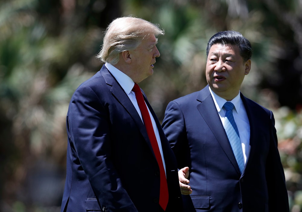 President Donald Trump and Chinese President Xi Jinping walk together after their meetings at Mar-a-Lago, on April 7, 2017, in Palm Beach, Fla. (AP)