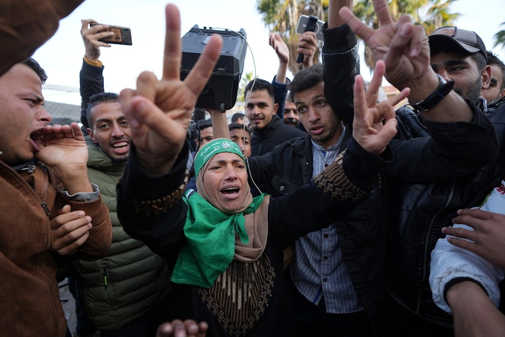 Palestinians celebrate the ceasefire agreement between Hamas and Israel at Al-Aqsa Hospital in Deir al-Balah, central Gaza Strip, on January 19, 2025. (AP)