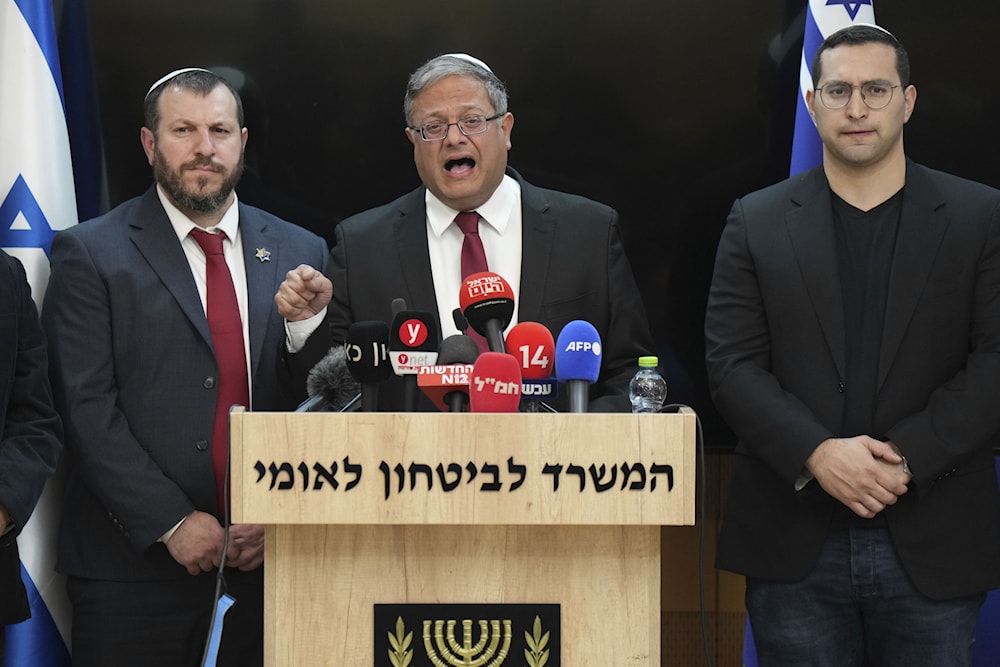 Israel's far-right Police Minister, Itamar Ben-Gvir, center, in a statement to the media, says he will quit if “Israel” approves Gaza ceasefire, at his office in occupied al-Quds on Thursday, Jan. 16, 2025. (AP)