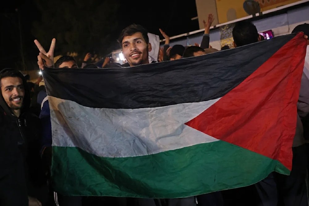 Palestinians react to news on a ceasefire deal with Israel in Deir el-Balah  in the Central Gaza Strip on January 15,2025. (AFP)