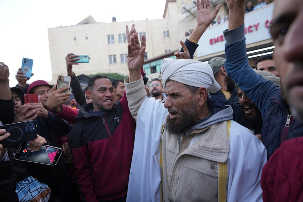 Palestinians celebrate the ceasefire agreement between Hamas and Israel at Al-Aqsa Hospital in Deir al-Balah, central Gaza Strip, on January 19, 2025. (AP)