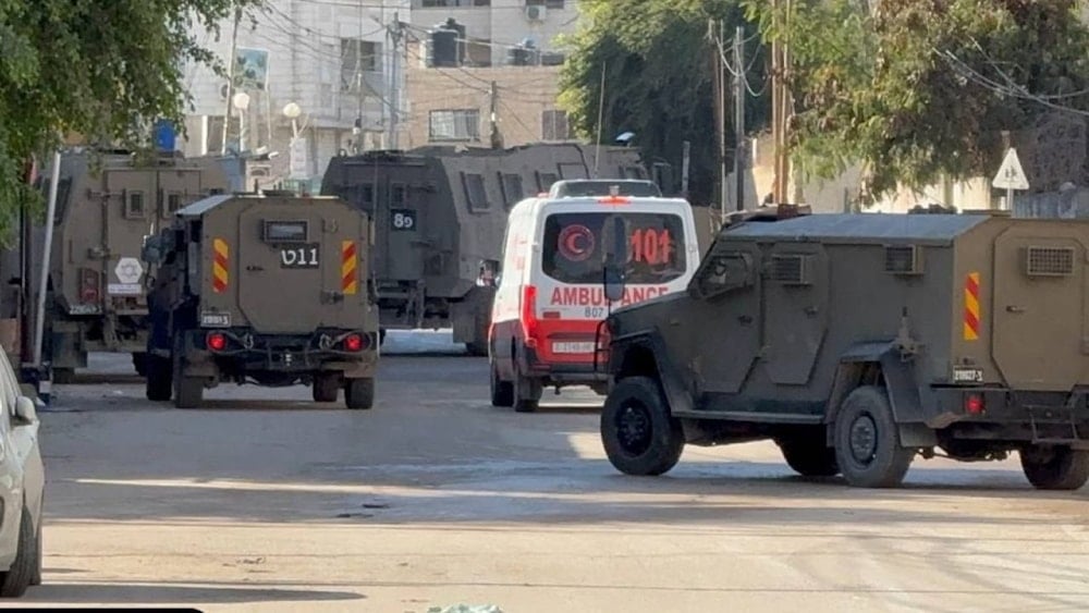 Israeli military vehicles surround an ambulance in the West Bank, undated. (Social media)