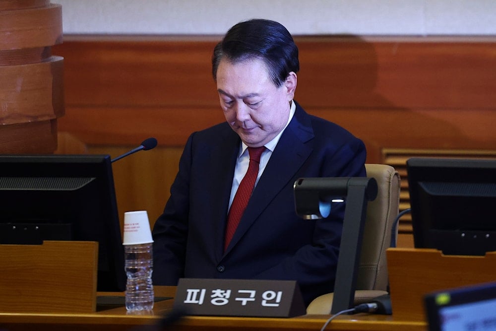 Impeached South Korean President Yoon Suk Yeol arrives for his impeachment trial at the Constitutional Court in Seoul, South Korea, Tuesday, Jan. 21, 2025. (Kim Hong-Ji/Pool Photo via AP)