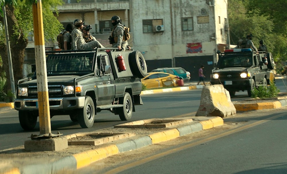 Popular Mobilization Forces, PMF, patrol outside the heavily fortified Green Zone, where the Prime Minister's headquarters is in Baghdad, Iraq, on May 26, 2021. (AP)