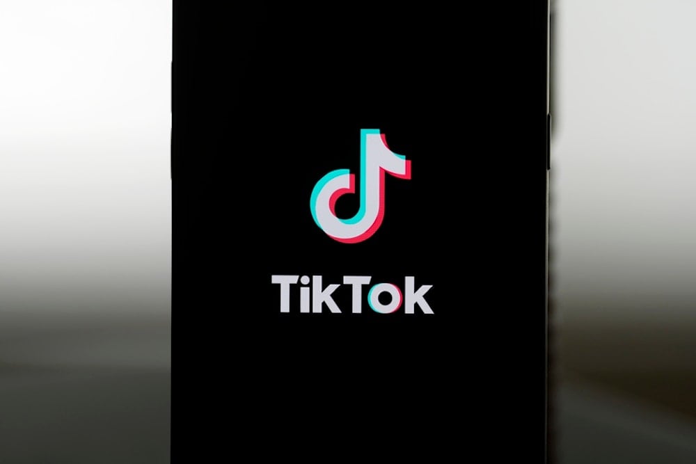 A TikTok logo is shown on a phone in San Francisco, Friday, Jan. 17, 2025. (AP Photo/Jeff Chiu)