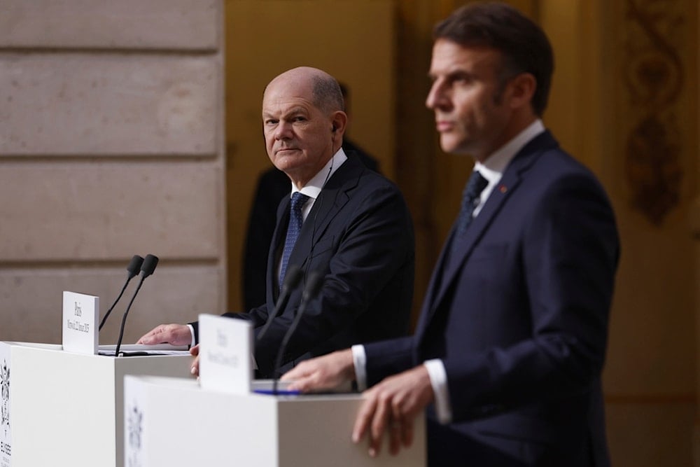 French President Emmanuel Macron, right, and German Chancellor Olaf Scholz give a joint statement at the Elysee Palace in Paris, Wednesday, Jan. 22 2025 (EPA via AP)