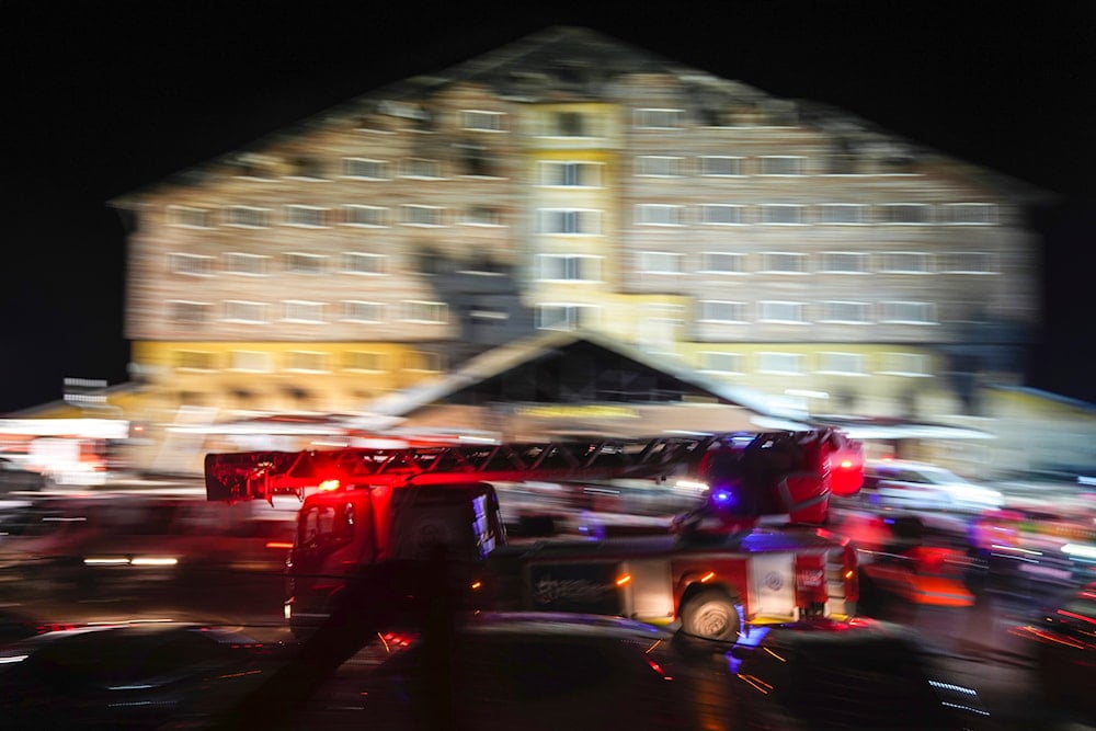 A firefighting truck leaves the scene where a fire broke out at a hotel in the ski resort of Kartalkaya, located in Bolu province, northwest Turkey, on January 21, 2025. (AP)