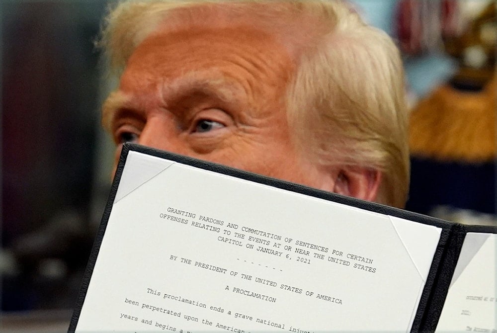 President Donald Trump signs an executive order in the Oval Office of the White House, Monday, Jan. 20, 2025, in Washington (AP)