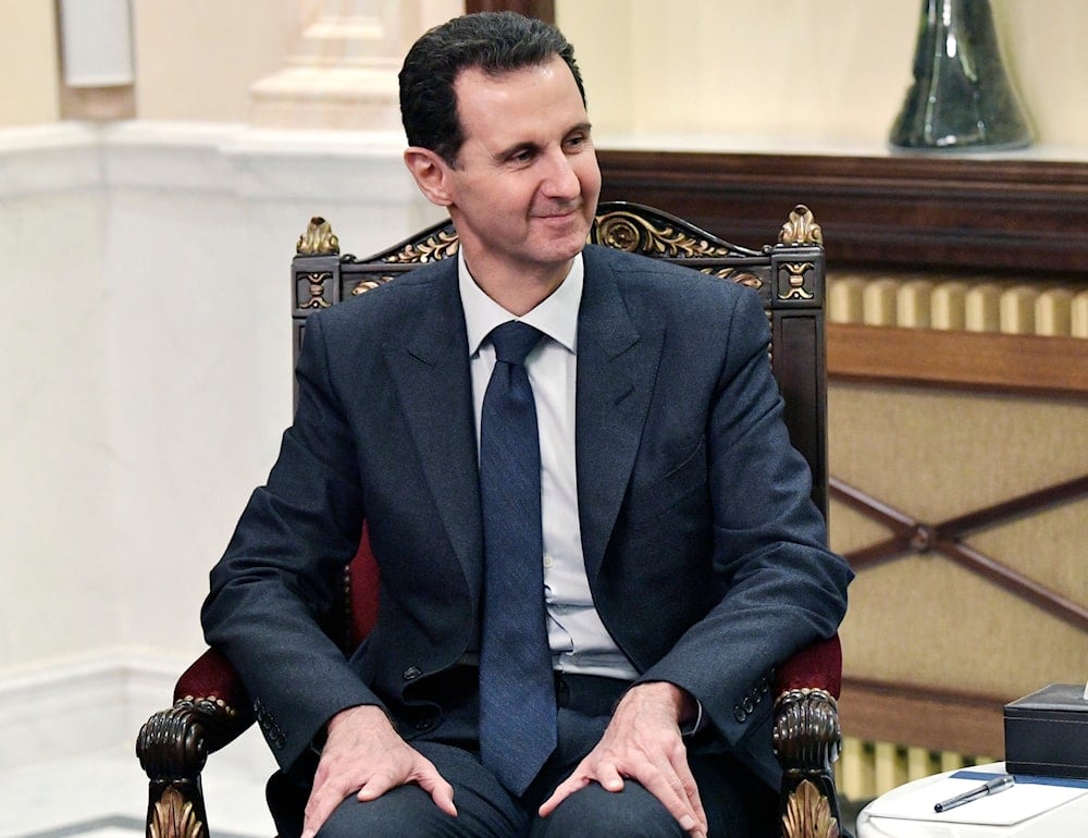 Syrian President Bashar Assad listens to Russian President Vladimir Putin during their talks in Damascus, Syria, on January 7, 2020. (AP)