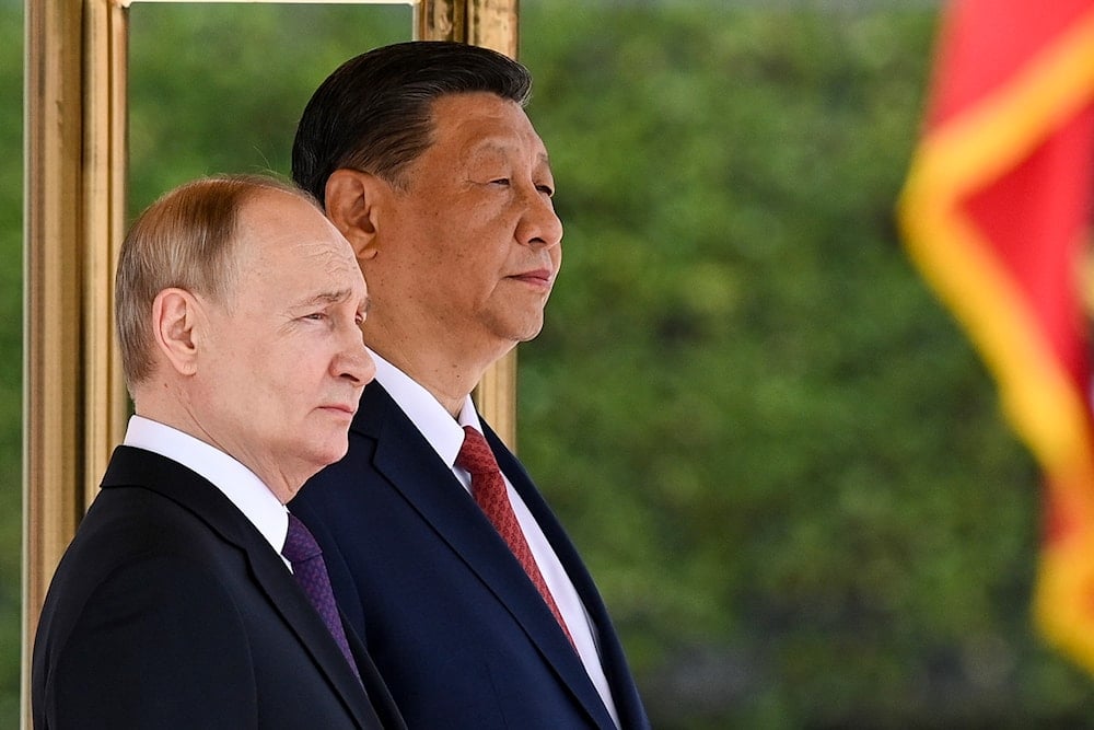 Chinese President Xi Jinping, right, and Russian President Vladimir Putin attend an official welcome ceremony in Beijing, China, on May 16, 2024. (Sergei Bobylev, Sputnik, Kremlin Pool Photo via AP)