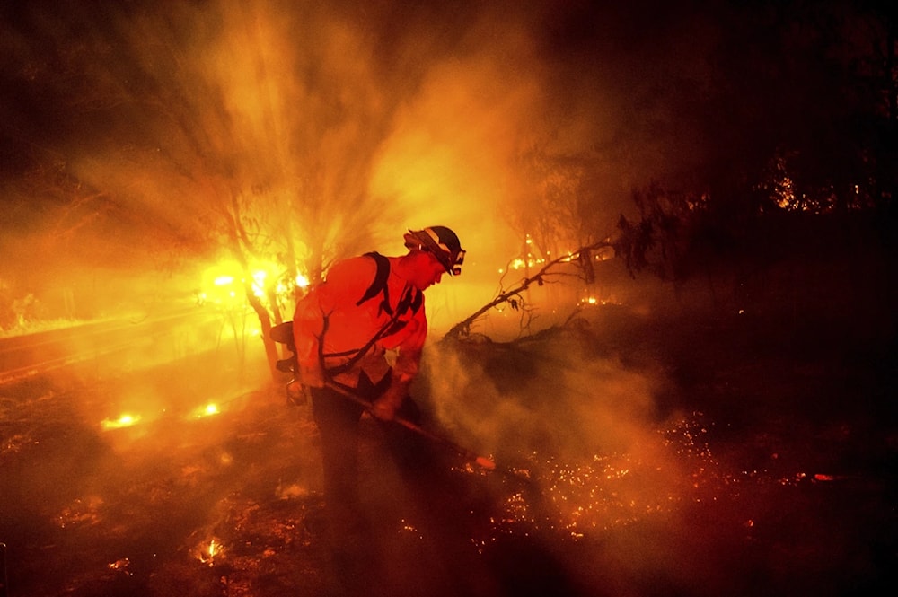 Firefighter Chris Fritz works to keep the Aero Fire from spreading through the Copperopolis community of Calaveras Country, Calif, on Monday, June 17, 2024. (AP) 