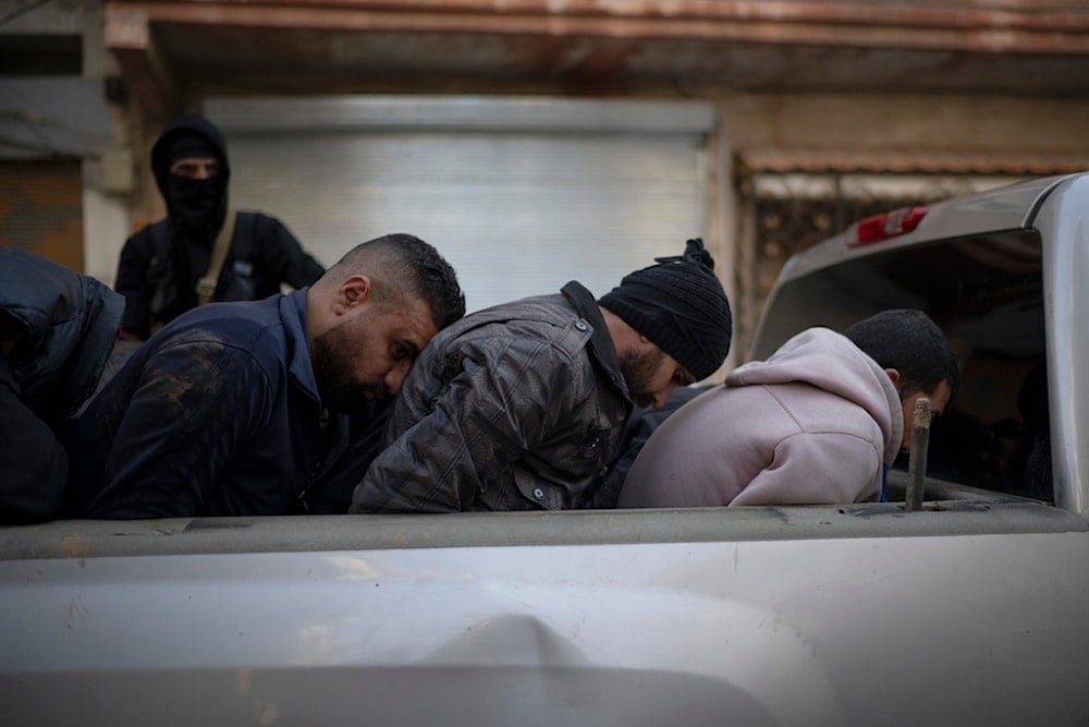 Men suspected of being part of militias or loyalist soldiers of the ousted president Bashar Assad are detained by members of the new security forces during an operation in Homs, Syria, Friday, Jan. 3, 2025 (AP)