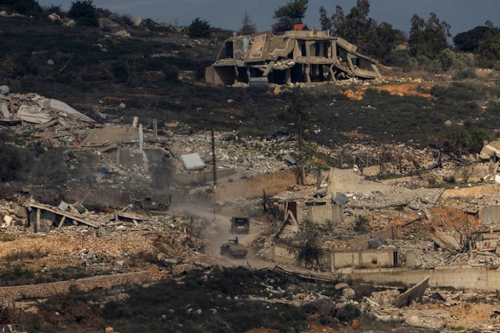 Israeli soldiers drive inside a village in southern Lebanon, as seen form northern occupied Palestine, Thursday, Jan. 23, 2025 (AP)