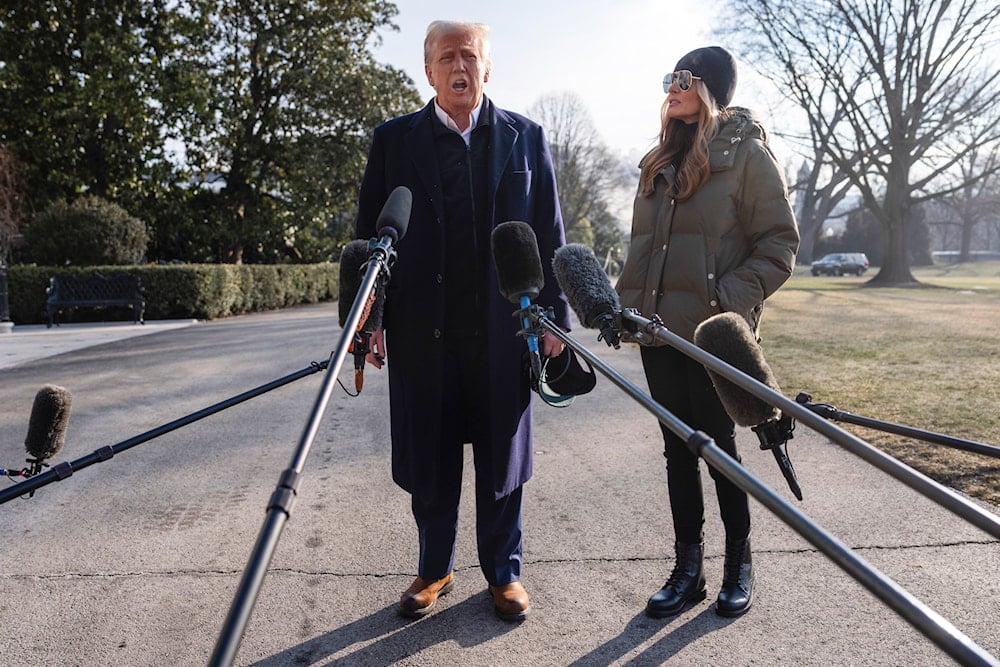 First lady Melania Trump looks on as President Donald Trump speaks with reporters before boarding Marine One on the South Lawn of the White House, Friday, Jan. 24, 2025, in Washington. (AP)