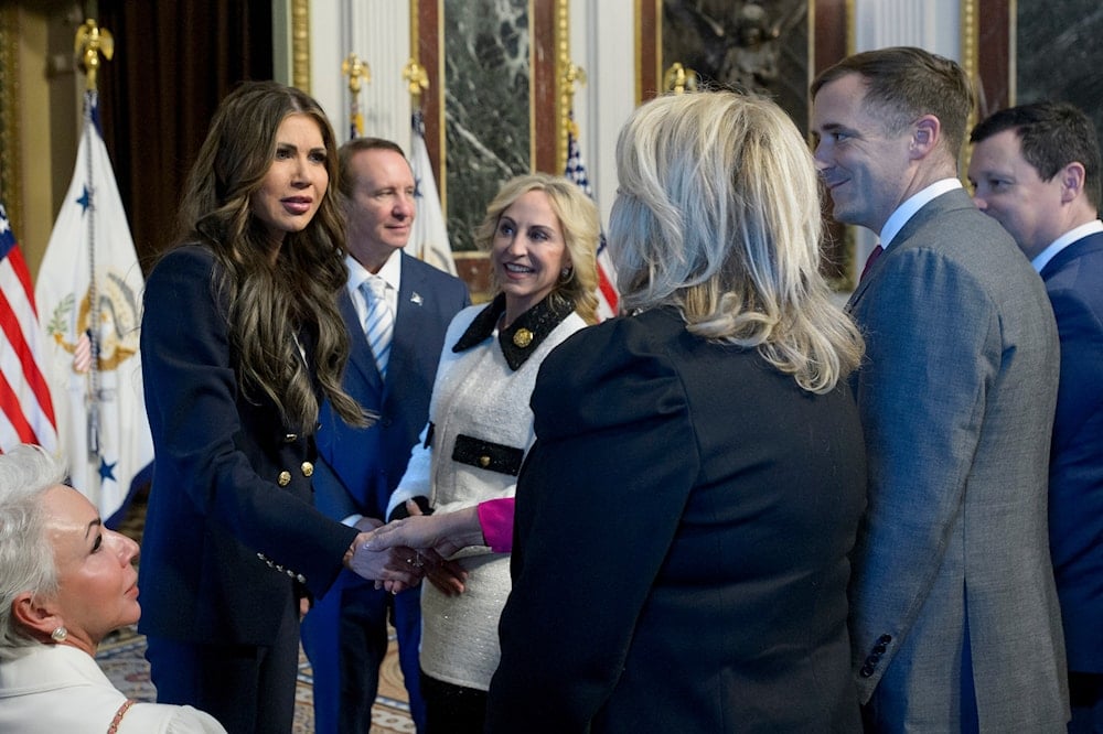 Kristi Noem, President Donald Trump's nominee for Secretary of Homeland Security, left, greets guests in the Indian Treaty Room of the Eisenhower Executive Office Building on the White House campus in Washington, on January 25, 2025. (AP)