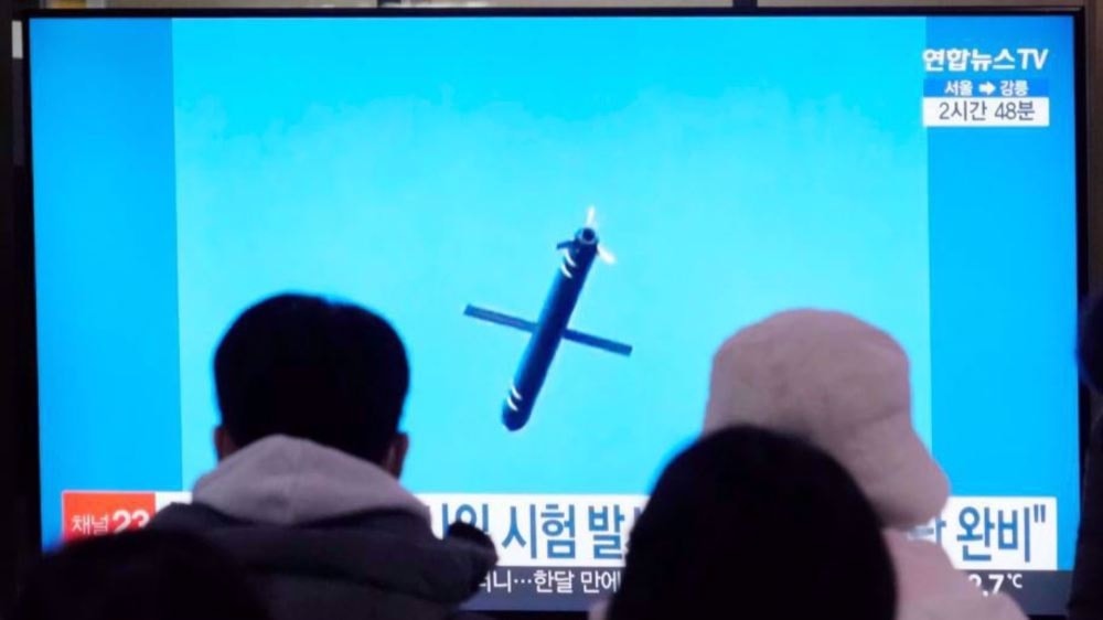 The image shows a launched DPRK missile as seen on a television at a railway station in Seoul, South Korea, on Jan. 26, 2025. (AP)