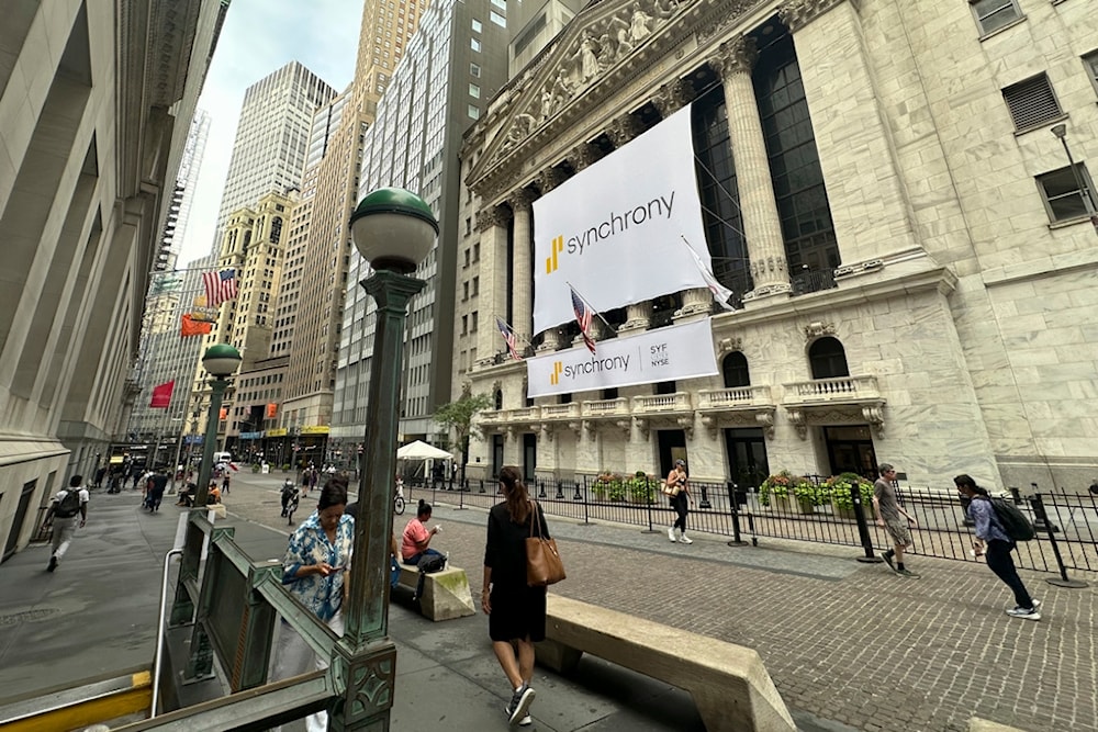 People pass the New York Stock Exchange on Wednesday, July 31, 2024 in New York. (AP)